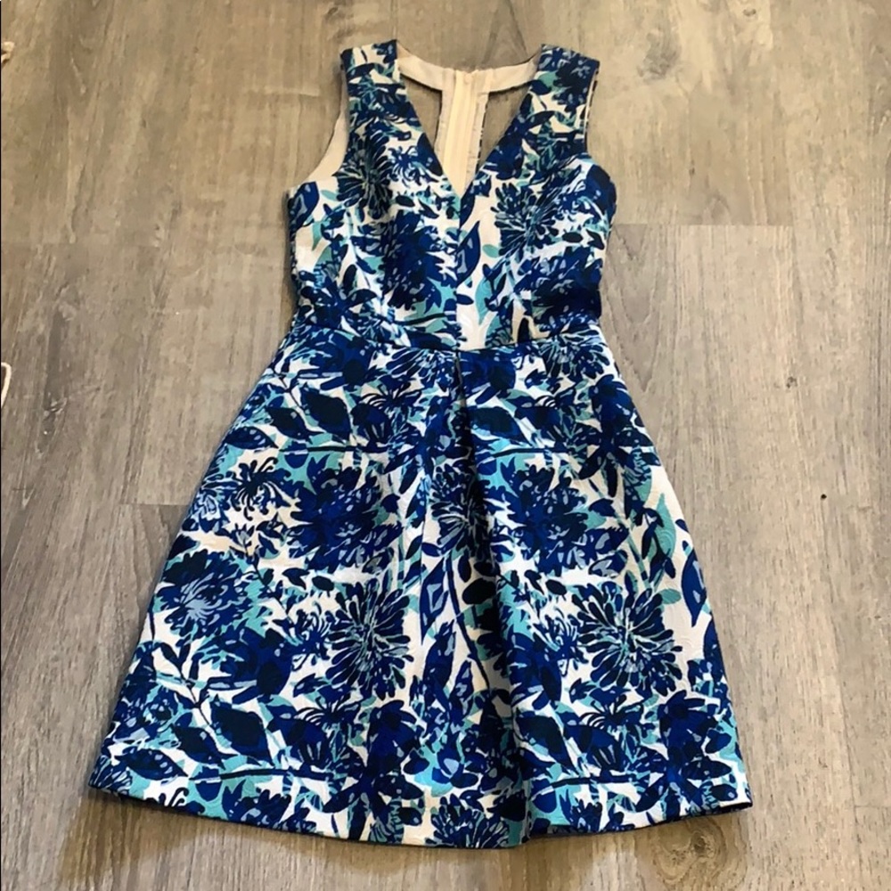 Blue floral structured coattail dress.